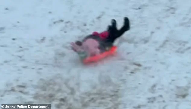 Chaotic Snow Day Incident in Jenks: Officer's Accidental Collision with Child Goes Viral, Sparking Mixed Reactions