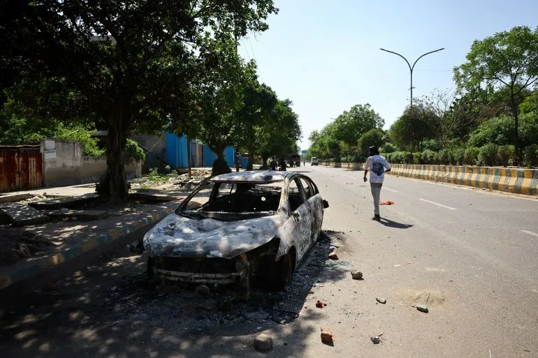 Violence Erupts in Noida as Workers' Protest Over Wages Turns to Chaos Amid Global Crisis