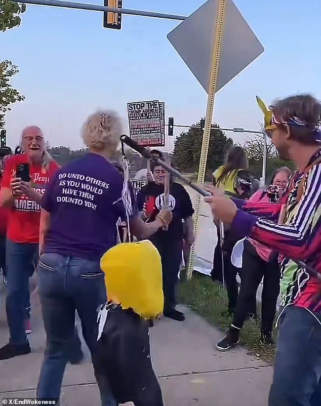Kindness Shirts and Metal Pipes: Protester Smashes Trump Piñata